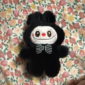 Black Plush Character with Striped Bow Accent